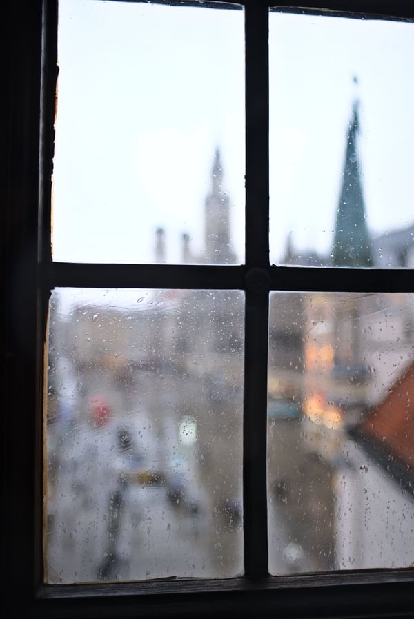 Rathaus-Glockenspiel in Marienplatz viewed through a window in the Spielzeugmuseum (old town hall toy museum), Munich, Germany