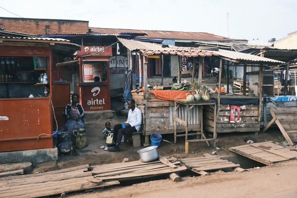 A family and a fruit stand, Uganda