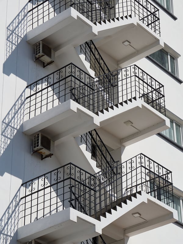 Zoomed in white building, stairwell and light, Penang, Malaysia