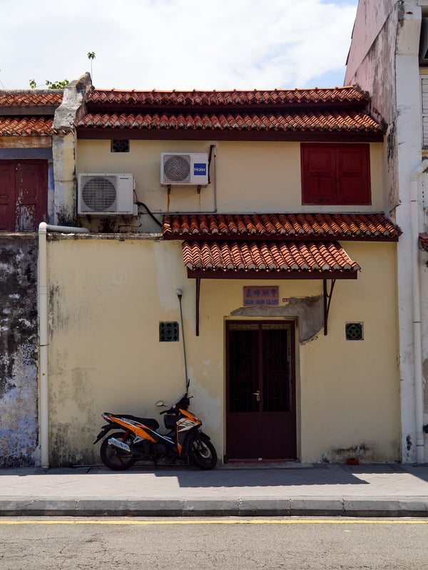 Harsh light, entrance and motorcycle, Penang, Malaysia