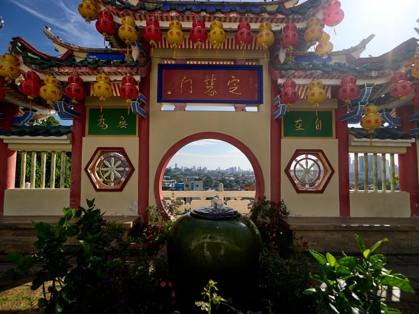 Cityscape through temple architecture, Kek Lok Si Temple, Penang, Malaysia