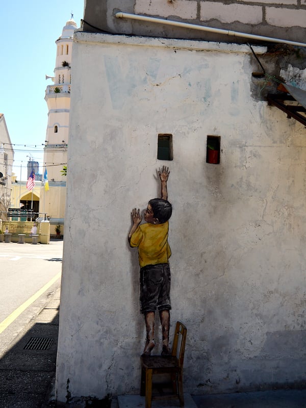 Boy on a chair street art, Penang, Malaysia
