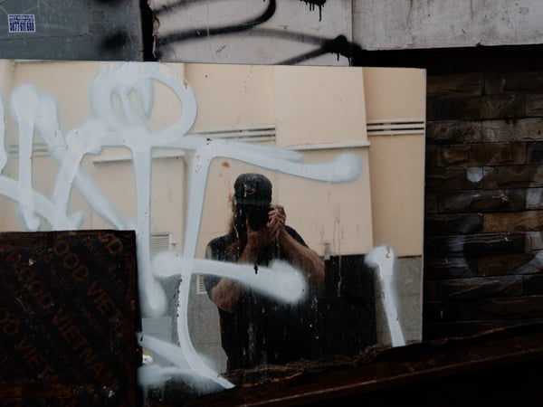 Reflection in broken mirror, alley way near laundry service, Ho Chi Min City, Vietnam