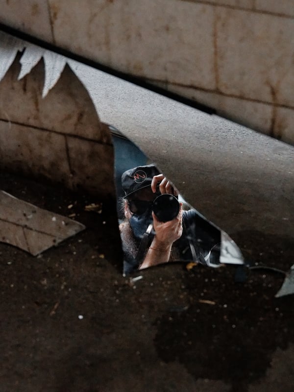 Reflection in broken mirror, alley way near laundry service, Ho Chi Min City, Vietnam