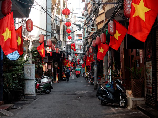 Decorated alley way with Vietnam flags, Ho Chi Min City, Vietnam